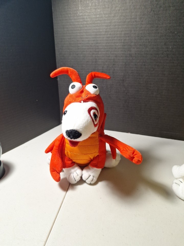 The product is a 7″ plush Target Bullseye Dog wearing a red lobster costume…