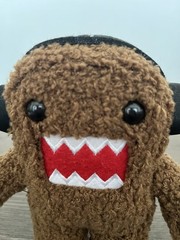 Domo Brown Plush Stuffed Animal Surface