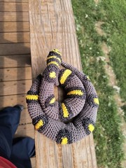 Snake crocheted, soft, handmade, gray with black and yellow markings, weighted