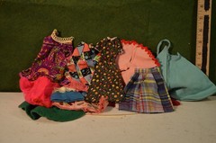 Large amount of doll clothes, some Barbie, several sizes, mostley girl, 60-70’s