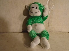 KELLYTOY Green Plush Monkey. 10 inches of cuteness. Sits rather nicely. Smilling