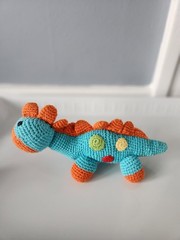 Pebble Crochet Dinosaur 100% Organic Cotton Plush. Infant Rattling Plus Dinosaur