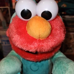Sesame Street Dino Stomp Elmo 13-Inch Plush Stuffed Animal Sings & Dances Clean