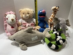 Collection of 18 various stuffed animals and characters.