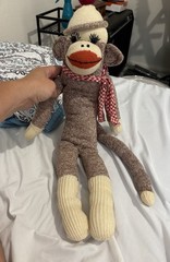 Brown and cream 20” sock monkey with red and white checkered scarf and hat