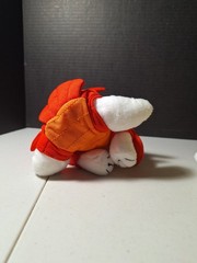 The product is a 7″ plush Target Bullseye Dog wearing a red lobster costume…